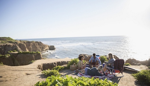 Image of a group of people gathered on the cliffs in La Jolla, California. 