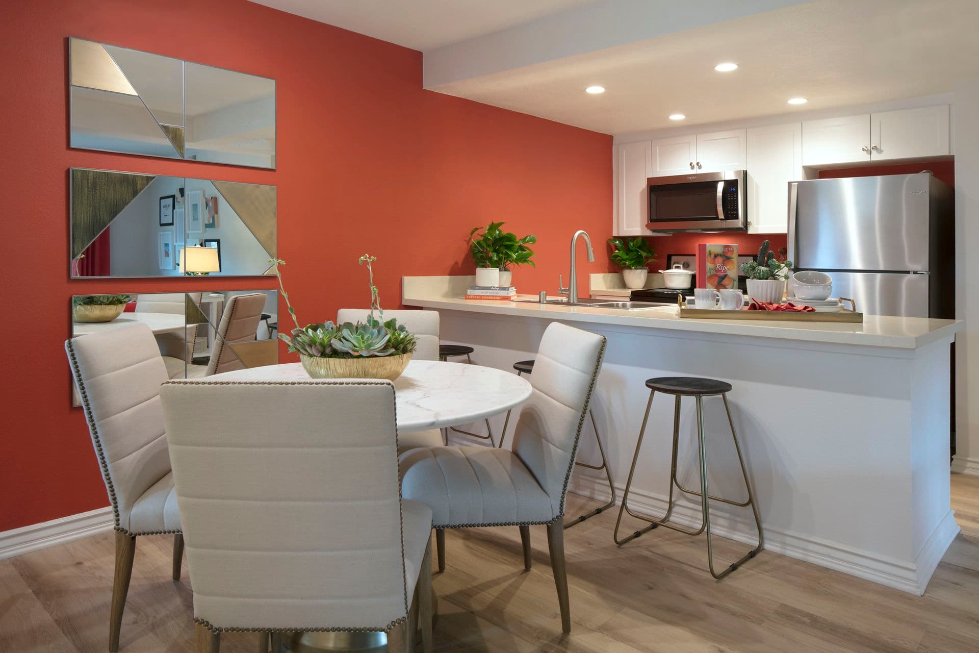 Interior view of dining and kitchen areas at Seascape Apartment Homes in Carlsbad, CA.