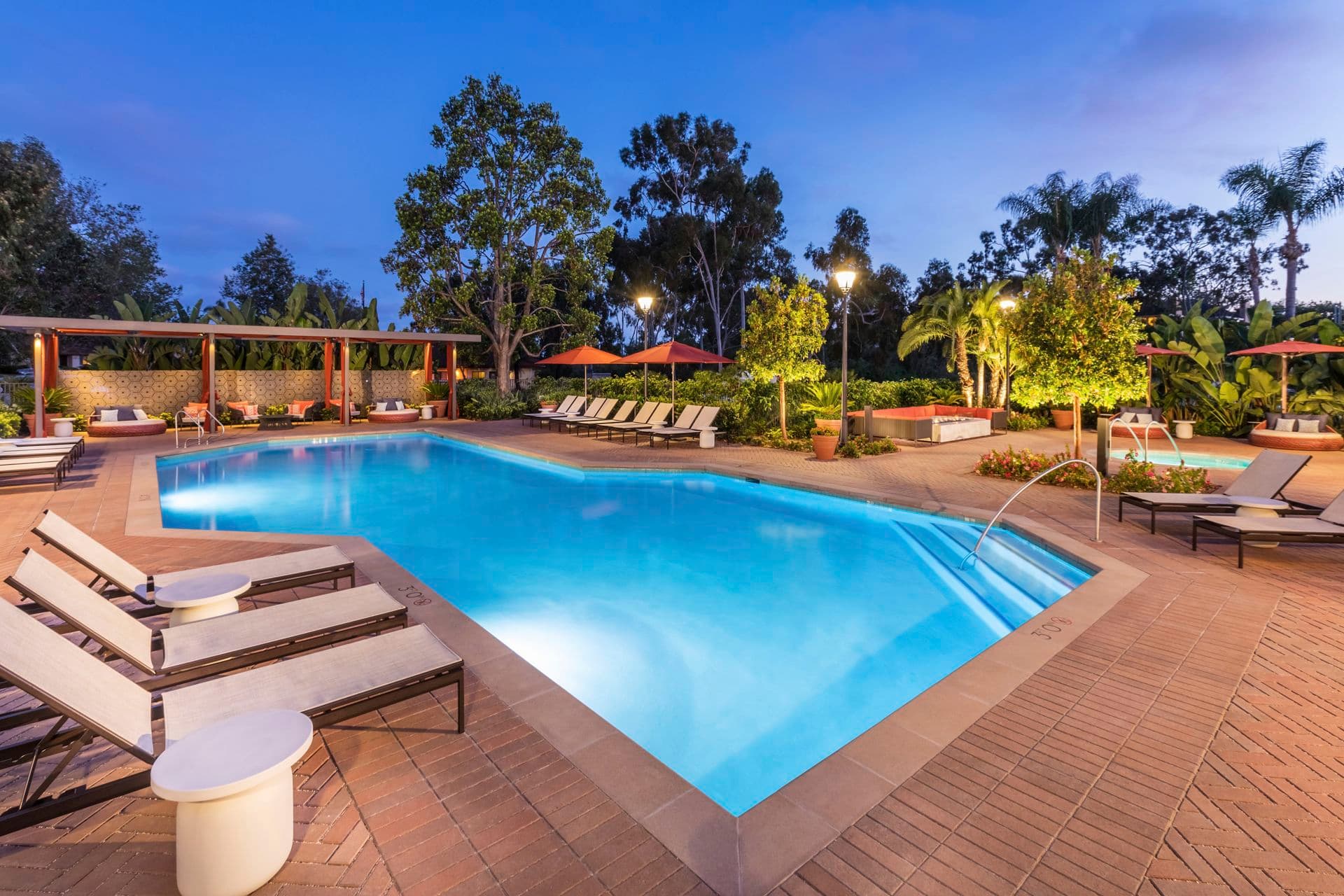 Exterior evening pool view at Seascape Apartment Homes in Carlsbad, CA.