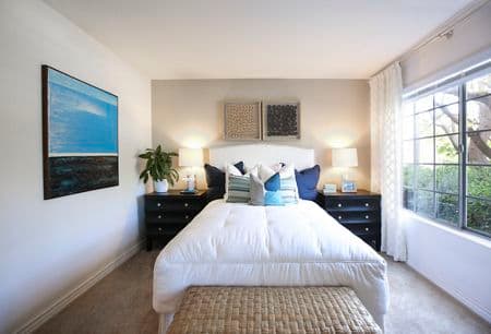 Interior view of bedroom at Solazzo Apartment Homes in La Jolla, CA.