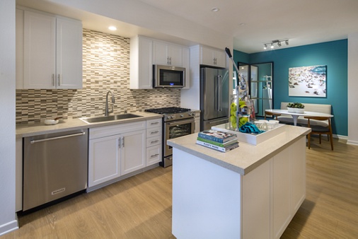 Interior view of kitchen of The Village Mission Valley Apartment Homes in San Diego, CA.