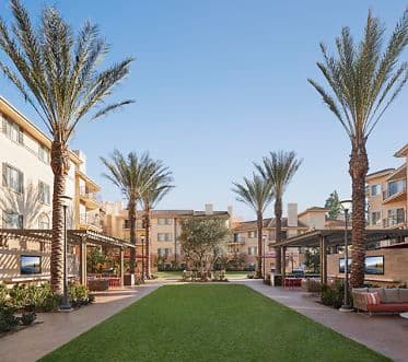Exterior view of lawn courtyard at The Villas of Renaissance in San Diego, CA.