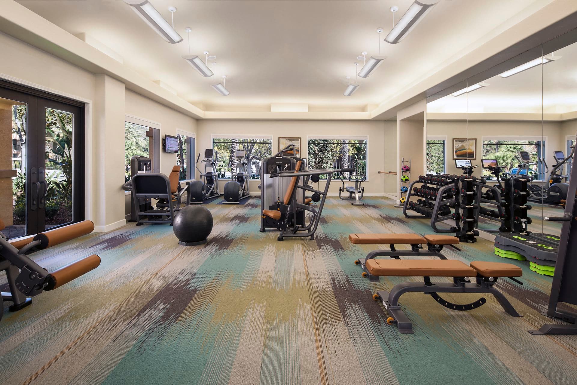 Interior view of fitness center at Torrey Hills Apartment Homes in San Diego, CA.