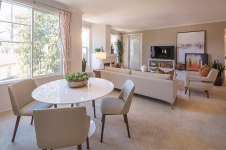 Interior view of dining room and living room at Torrey Villas Apartment Homes in San Diego, CA.