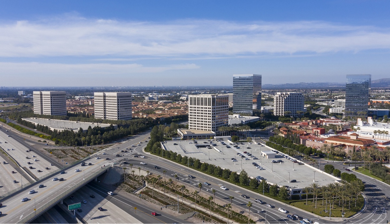 Aerial view of the Irvine, California skyline on a gorgeous day with the 405 Freeway passing underneath.