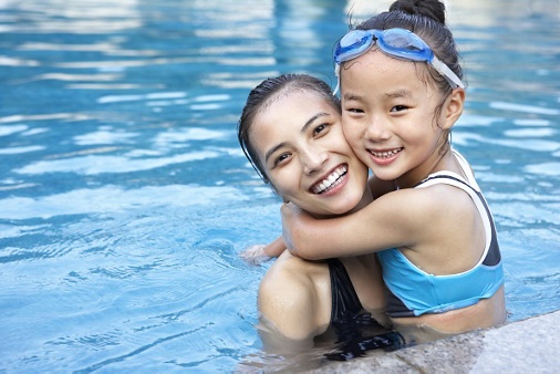 Exterior image of mother and daughter at pool
