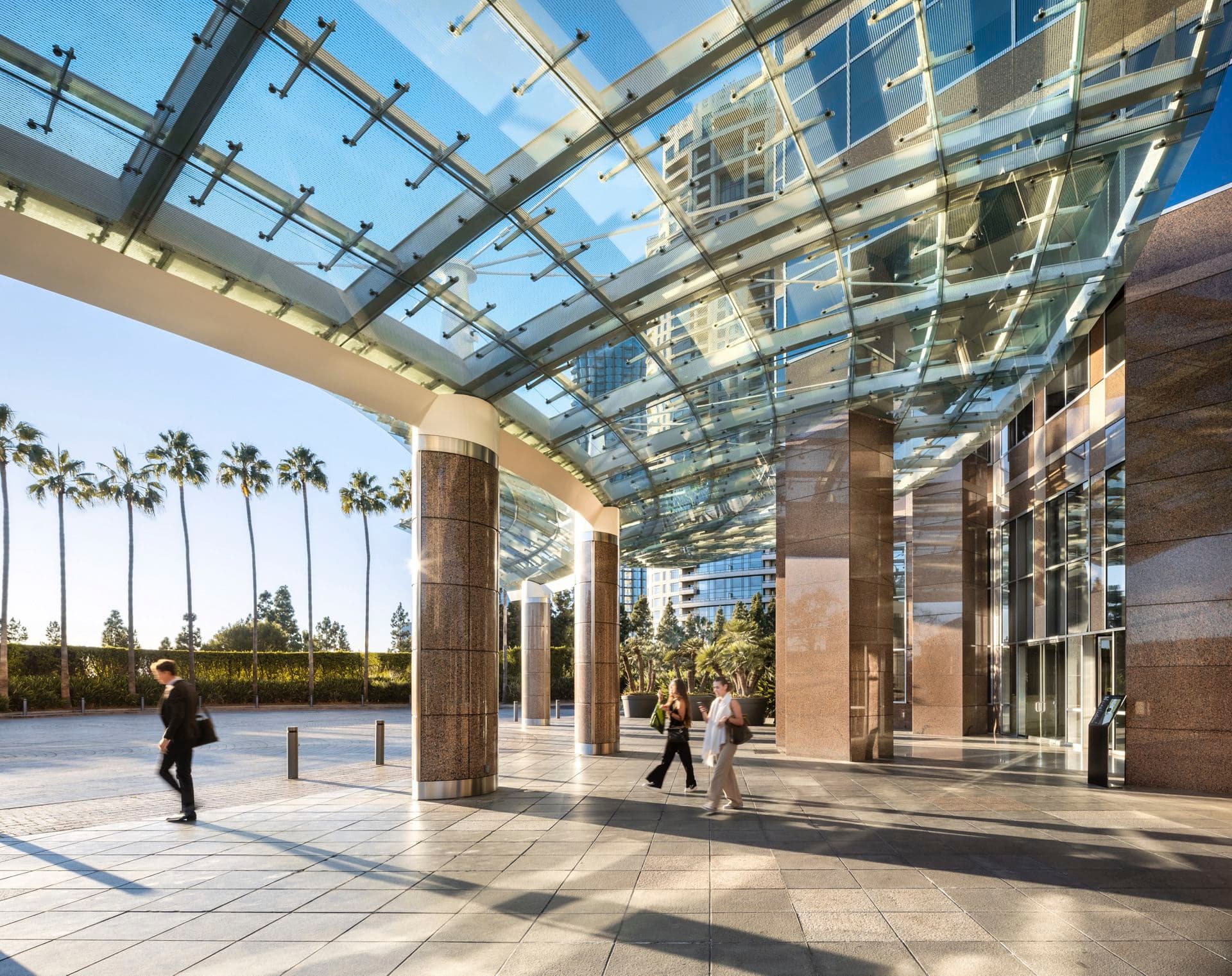 Exterior view of the office building entrance at 2121 Avenue of the Stars in Los Angeles, CA.