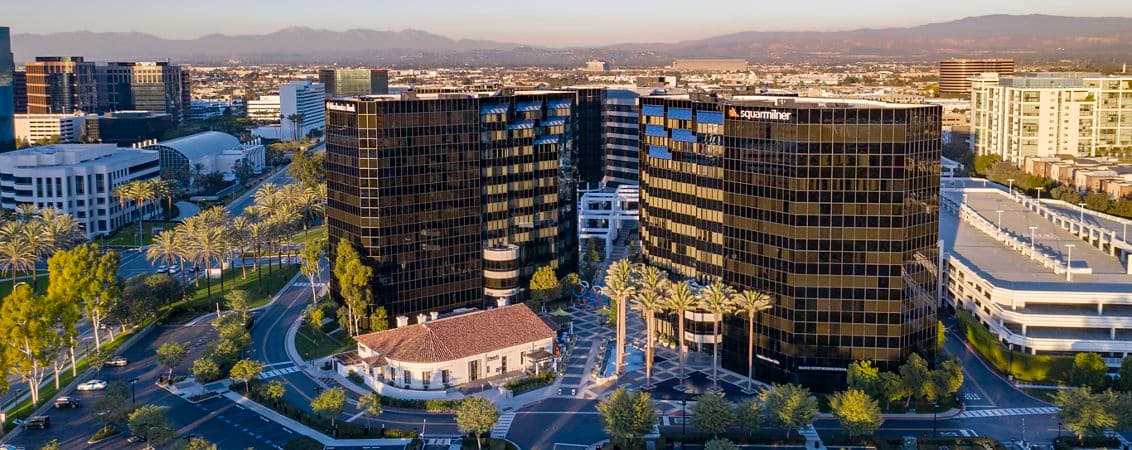Aerial photography of Irvine Towers featuring snowy mountains in Irvine, CA 