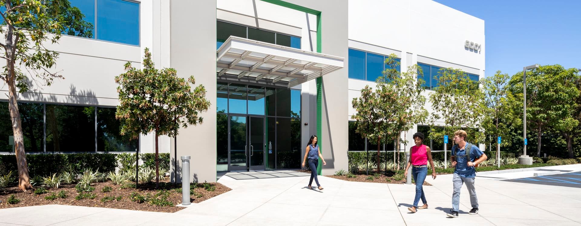 Lifestyle photography of the building entry at Oak Canyon Business Center - 6001 Oak Canyon in Irvine, CA