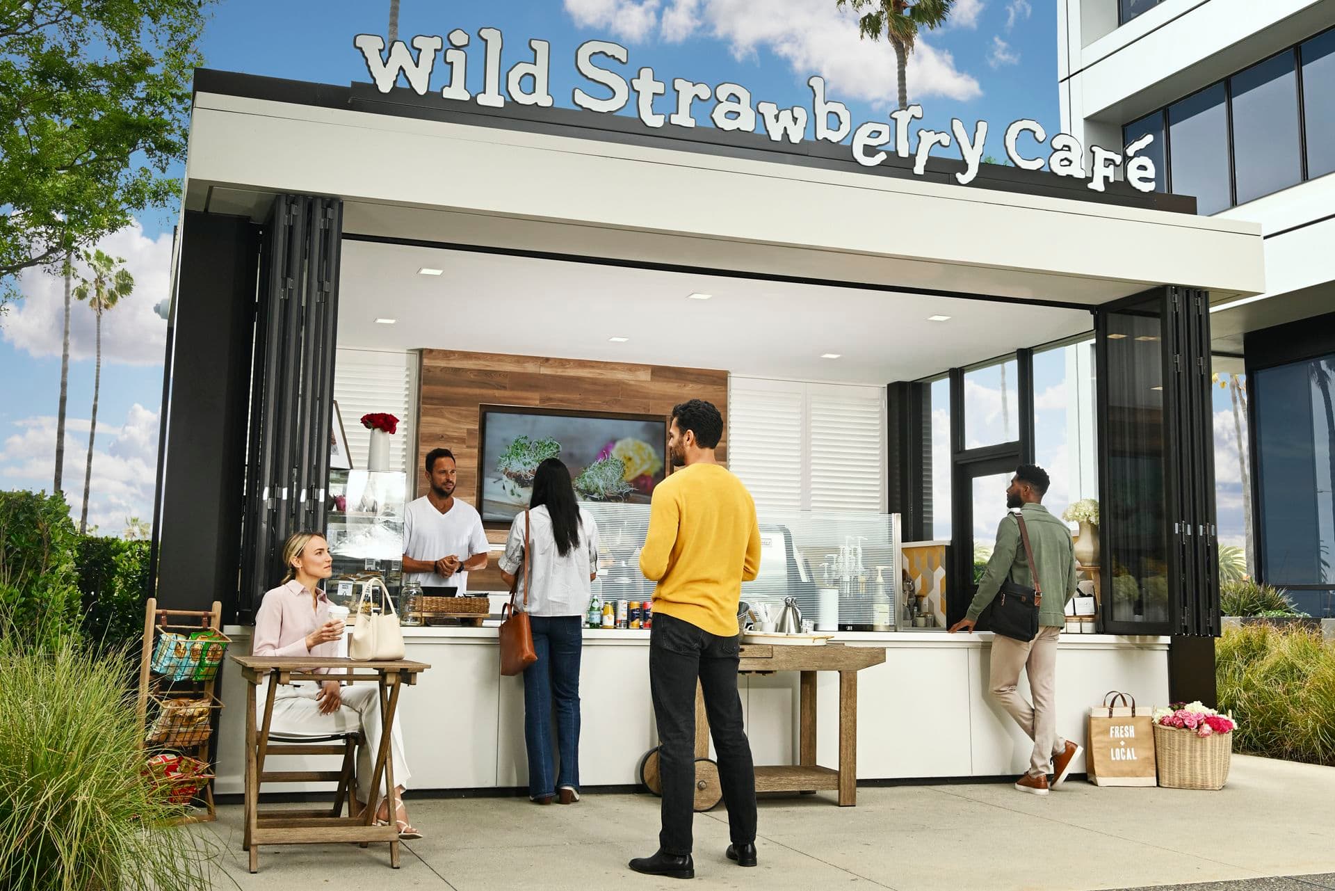 Exterior lifestyle photography of Wild Strawberry cafe at 610 Newport Center Drive, Newport Beach, CA.