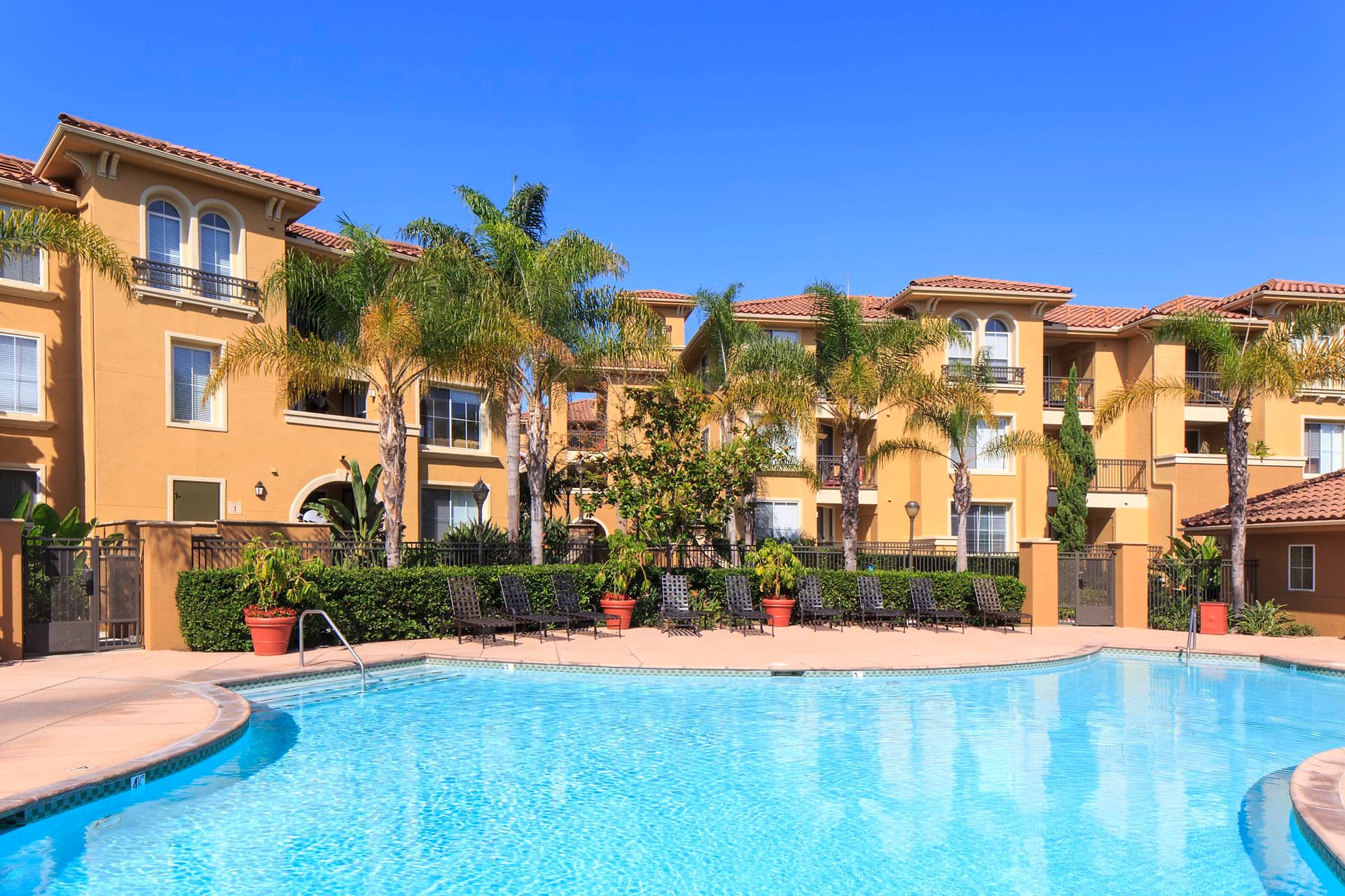 Exterior view of the pool at Newport Bluffs Apartment Homes in Newport Beach, CA. 