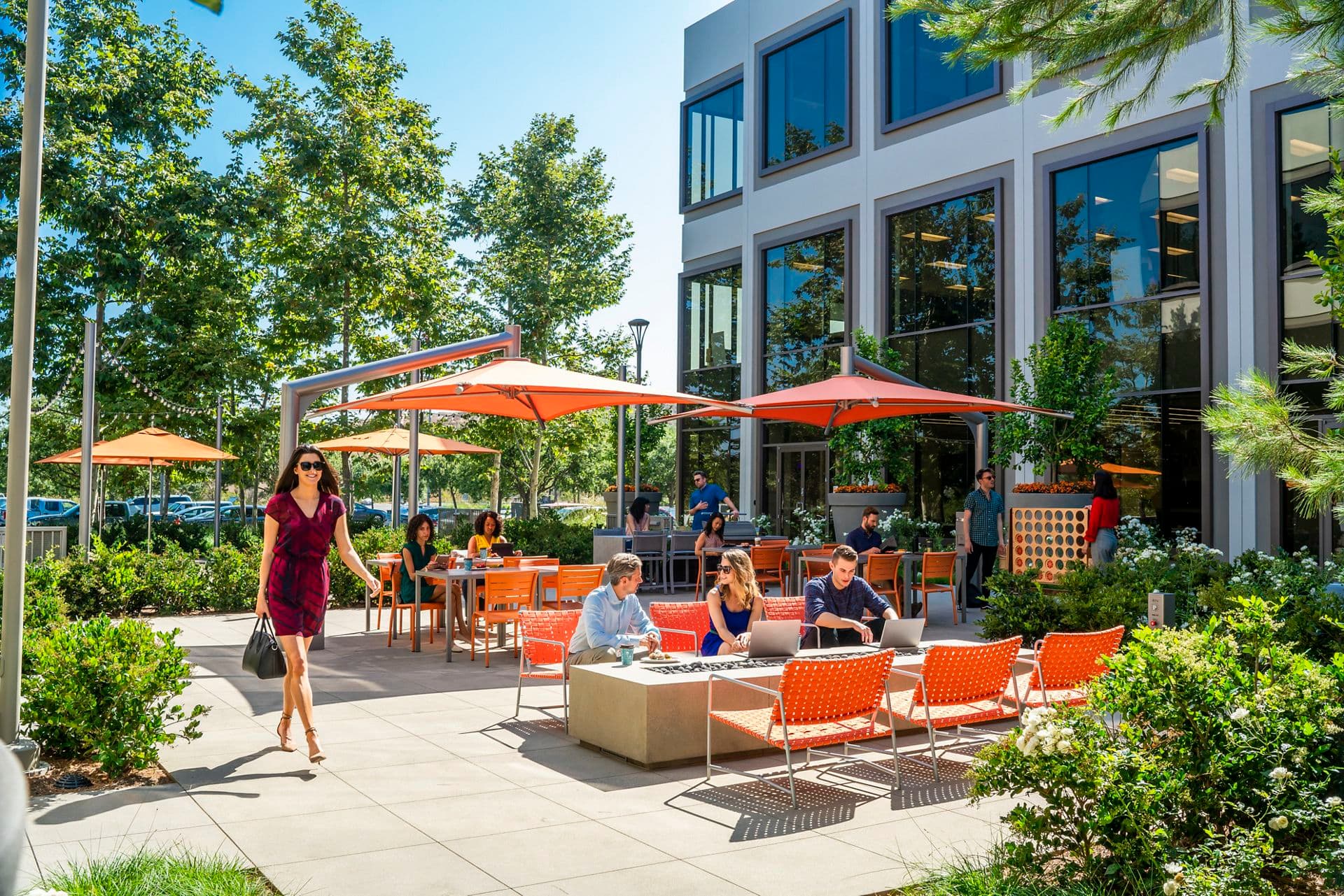 Lifestyle photography of Citrus Court, the outdoor workspace between 5290 and 5270 California Avenue at UCI Research Park in Irvine, CA