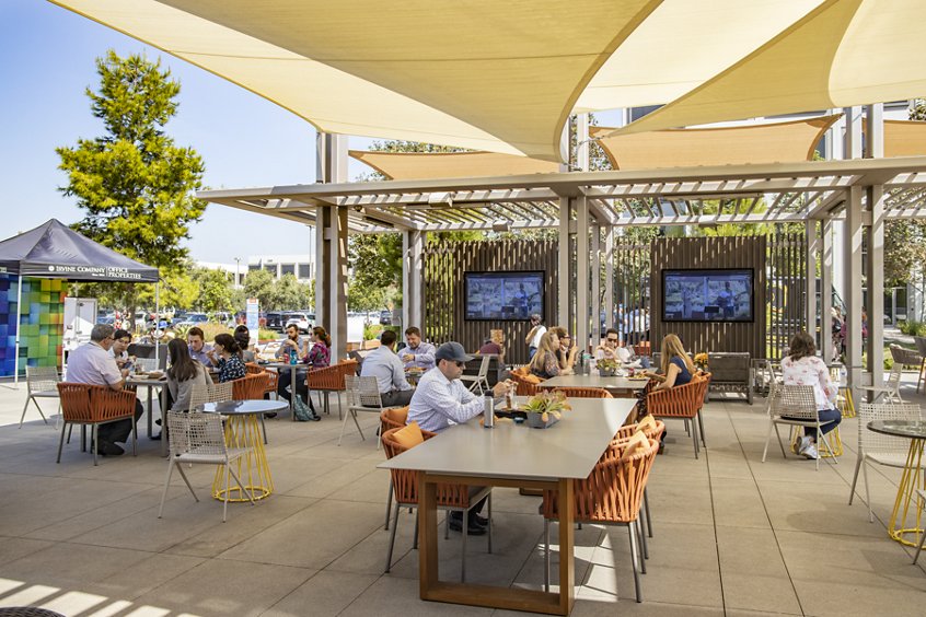 Lifestyle photography of the food trucks and people dining at The Commons at UCI Research Park in Irvine, CA