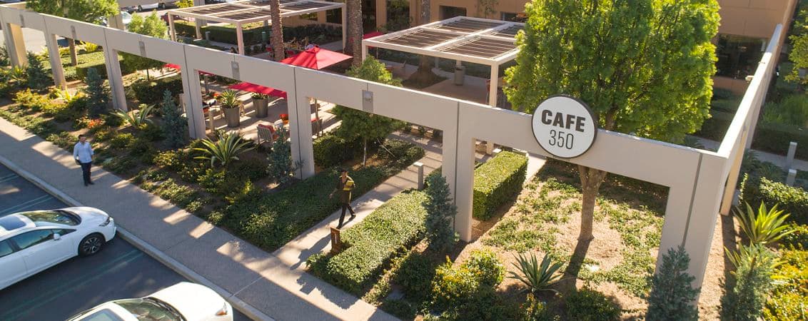 Aerial photography of The Commons featuring Cafe 350 signage and new rollup door at Market Place Center in Irvine, CA