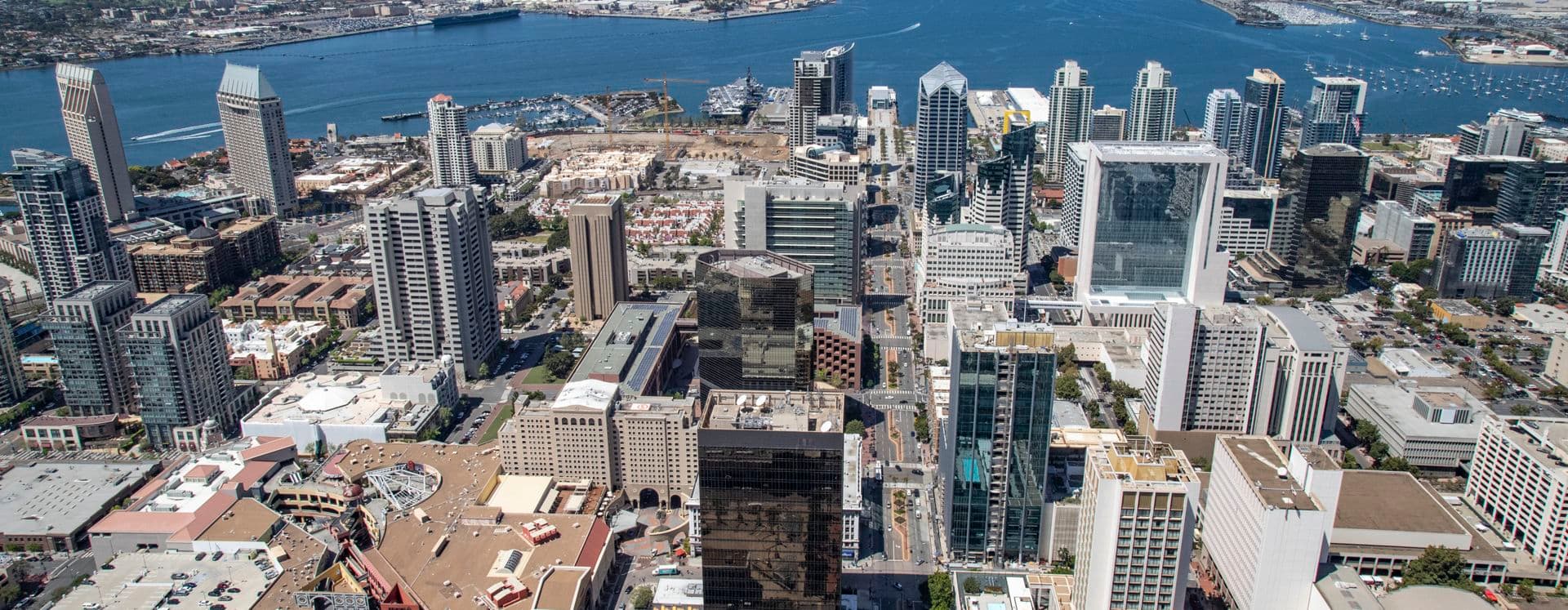 Aerial photography of downtown San Diego featuring 225 Broadway, 101 West Broadway, One America Plaza, and 501 West Broadway in San Diego, CA