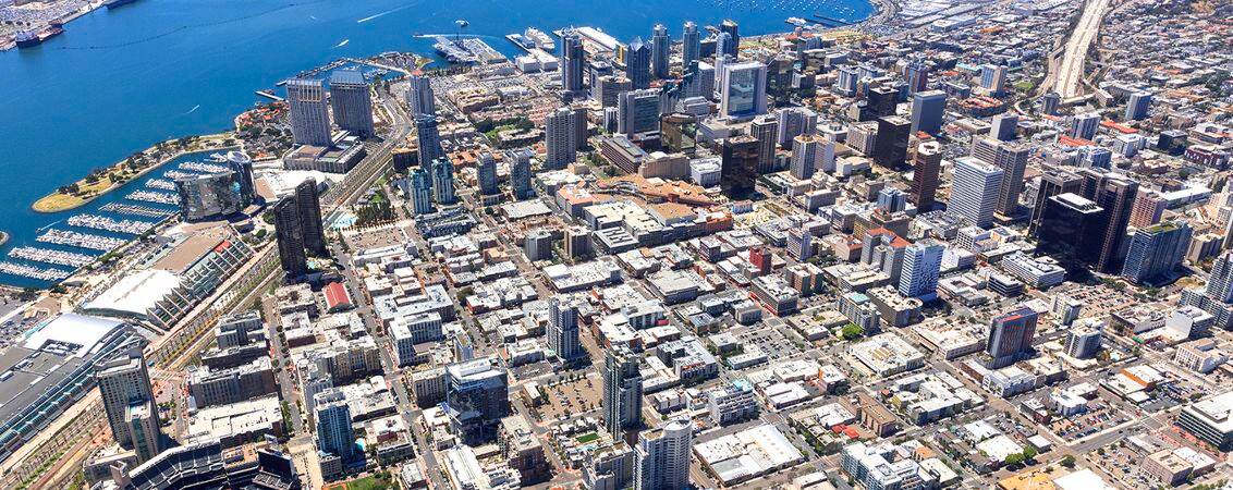 Aerial photography of downtown San Diego featuring 225 Broadway, 101 West Broadway, One America Plaza, and 501 West Broadway in San Diego, CA.