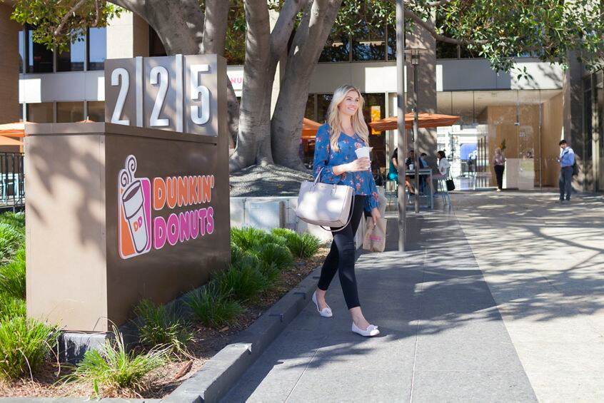 Lifestyle photography of Dunkin' Donuts amenity offering at 225 Broadway, San Diego, Ca