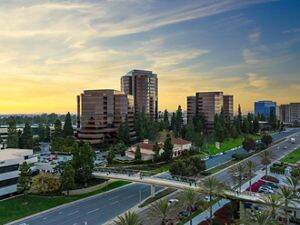Aerial view of The Plaza Office buildings at dusk in San Diego, CA.