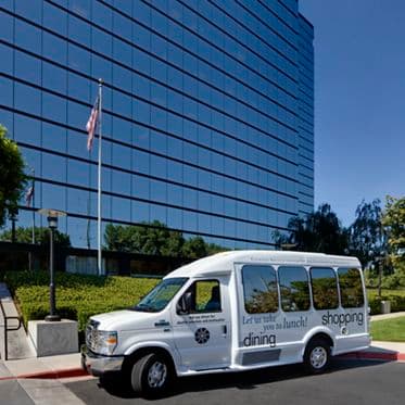 Customer Convenience Shuttle in front of 3131 Camino Del Rio office building at Centerside.
