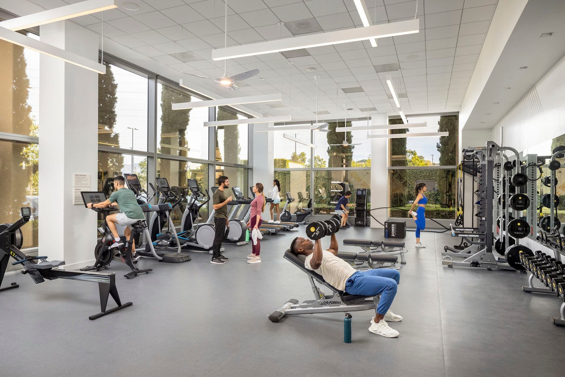 Lifestyle photography of the Kinetic fitness center offering at Santa Clara Gateway in Santa Clara, CA.