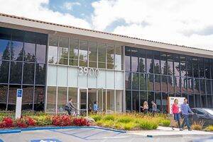 Lifestyle photography of the building entry at Santa Clara Park at Freedom Circle - 3900 Freedom Circle in Santa Clara, CA