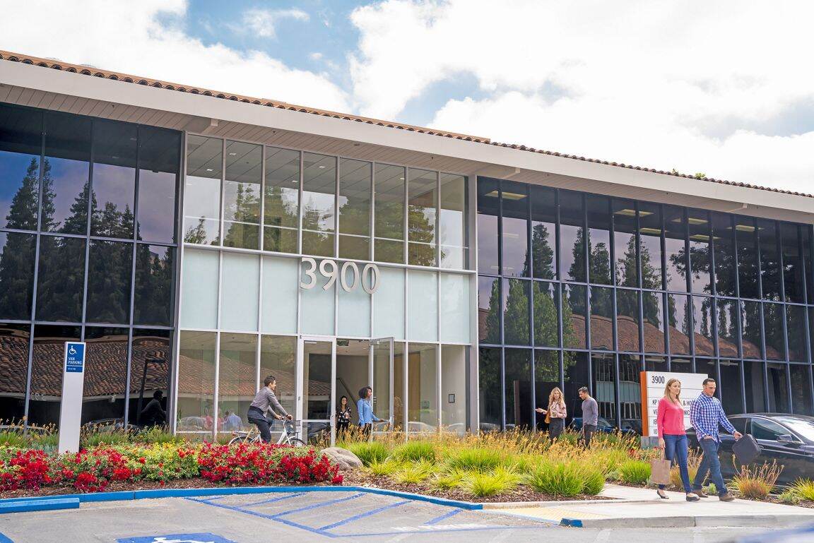 Lifestyle photography of the building entry at Santa Clara Park at Freedom Circle - 3900 Freedom Circle in Santa Clara, CA